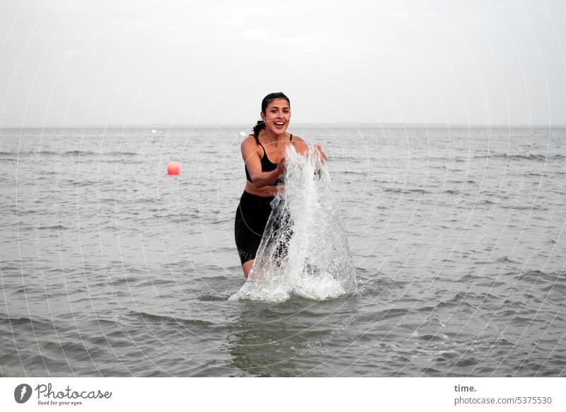 Build water columns again Woman bathe feminine Baltic Sea Water Horizon Buoy Swimsuit fun Relaxation talk rubbish splash water Dark-haired Long-haired Joy