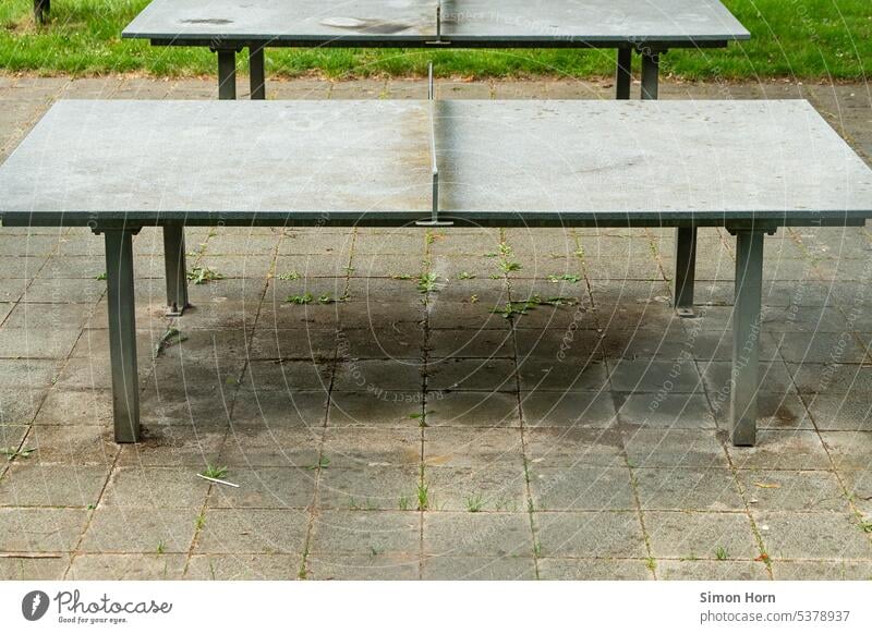 Two table tennis tables in a row Table tennis concentric Side by side Identical Meeting point youthful Leisure and hobbies Vanishing point Table tennis table