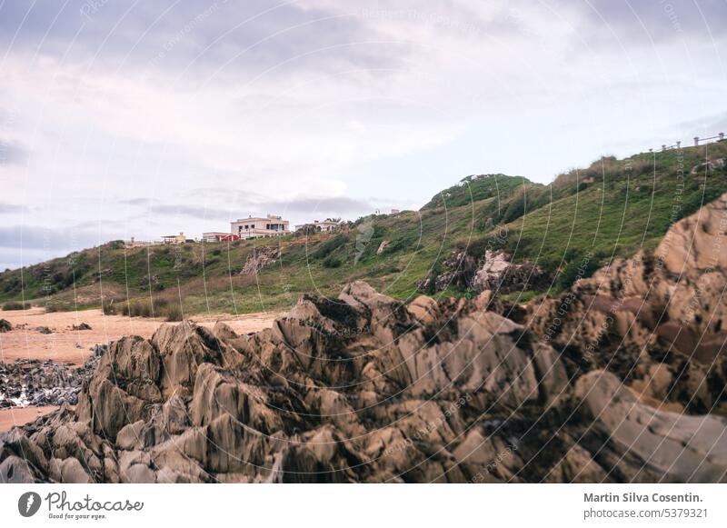 Sunset at Playa del Desplayado in the tourist city of La Pedrera in Uruguay. america ancient architecture atlantic background beach buildings coast coastline