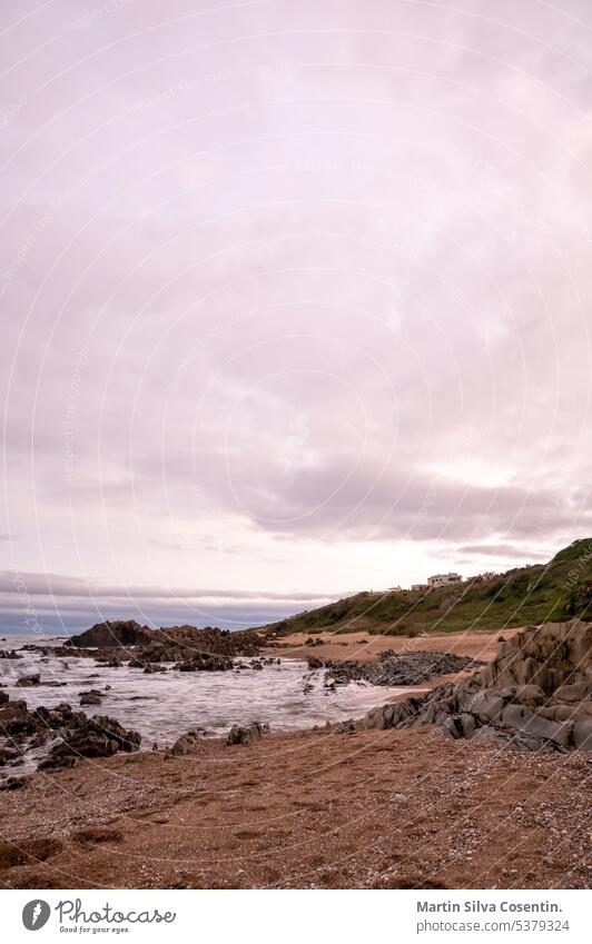 Sunset at Playa del Desplayado in the tourist city of La Pedrera in Uruguay. america ancient architecture atlantic background beach buildings coast coastline