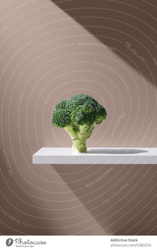 Green broccoli on white plain surface vegetable organic fresh leaf bunch vegetarian natural green healthy food light ingredient raw plant bright ripe vitamin