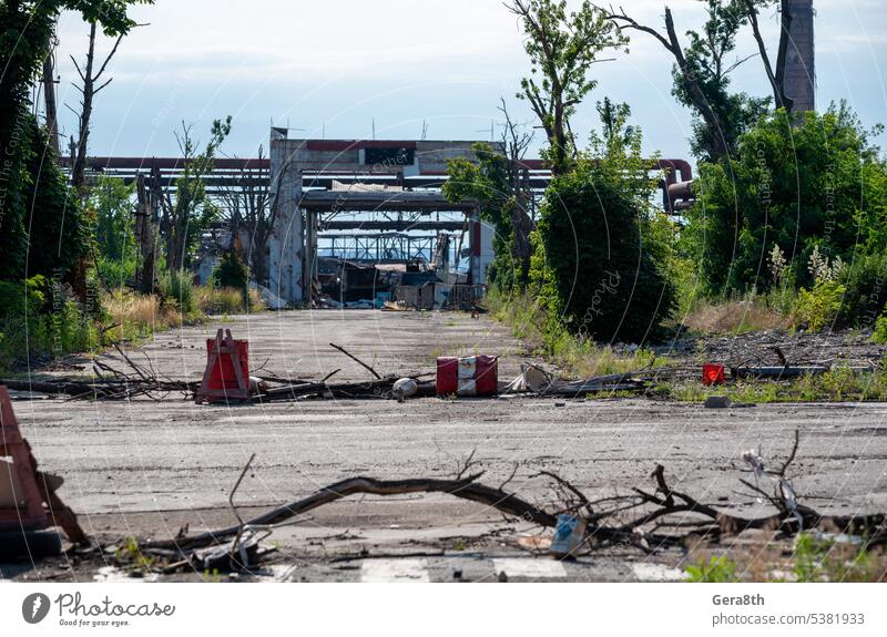 burnt cars and destroyed buildings of the workshop of the Azovstal plant in Mariupol Russia Ukraine abandon attack blackout blown up bombardment broken