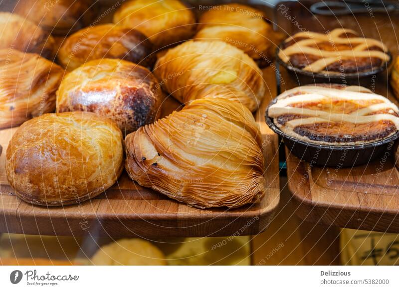 Delcious sweet pastries shown at a shop in Napels Italy italian window food Sfogliatell baked item breakfast snack nobody no people europe european