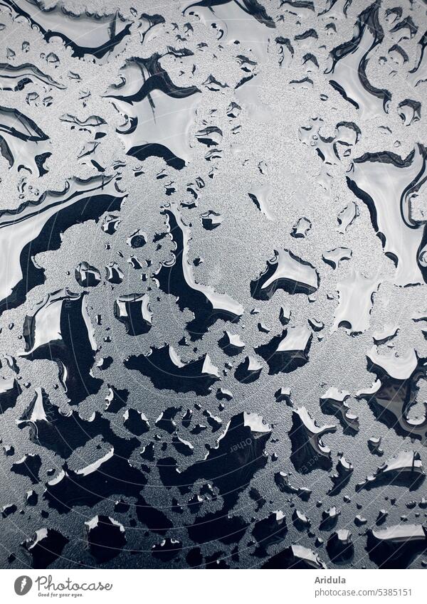 Water drops on black metal surface Drops of water Rain Black Metal smooth reflection Light Wet Close-up raindrops Structures and shapes