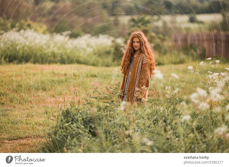 Redhead girl in the field Smiling pretty long hairs naturally Model Girl portrait redhead youthful Natural color Flower Beauty & Beauty Healthy Face Waldorf
