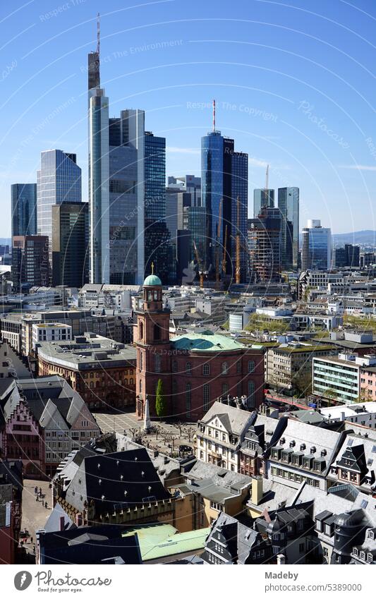 View from the tower of the cathedral on the old town, Paulskirche and the skyline in summer against a blue sky in the sunshine in Frankfurt on the Main in Hesse