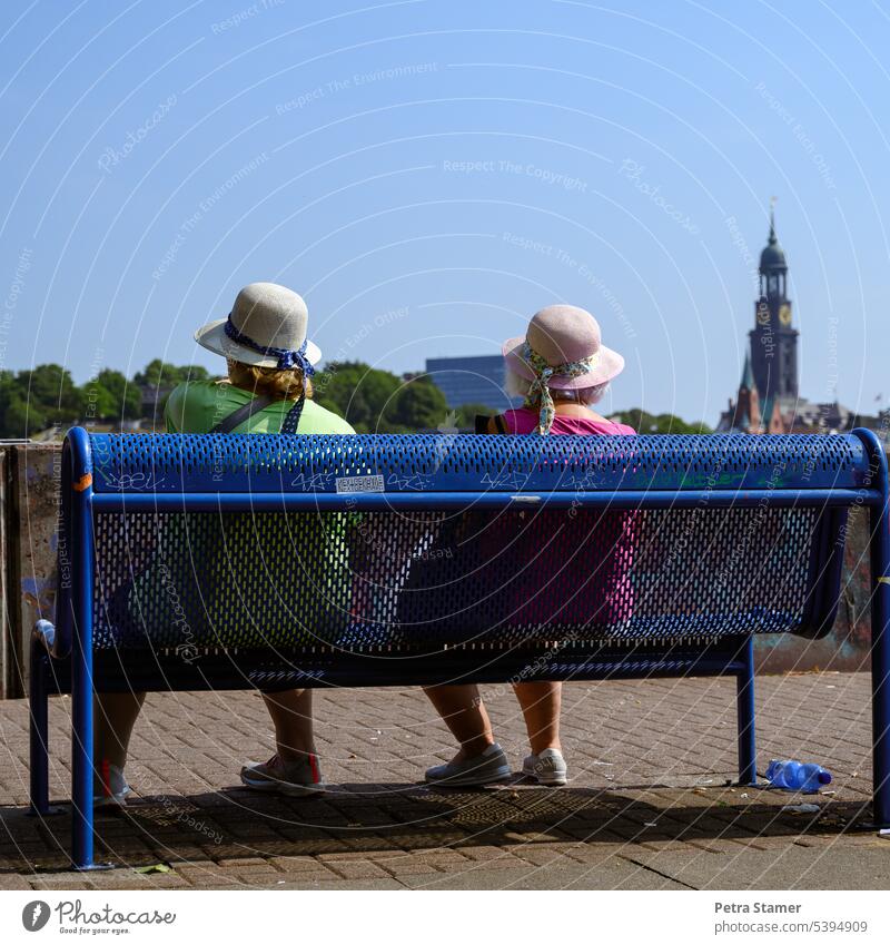 Two ladies with hat Women in middle adulthood women people person Hat Woman with hat bench Happy Outdoors Lifestyle more adult pretty relaxation relaxing Sit