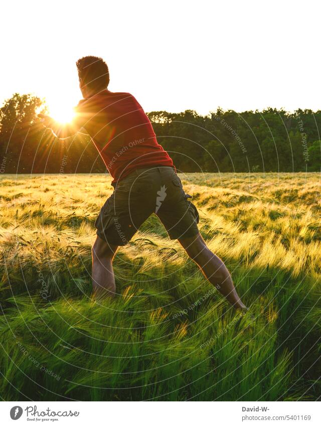 Capture the sun Sun Sunlight Field Man magical Sunset Flying Nature Light Environment