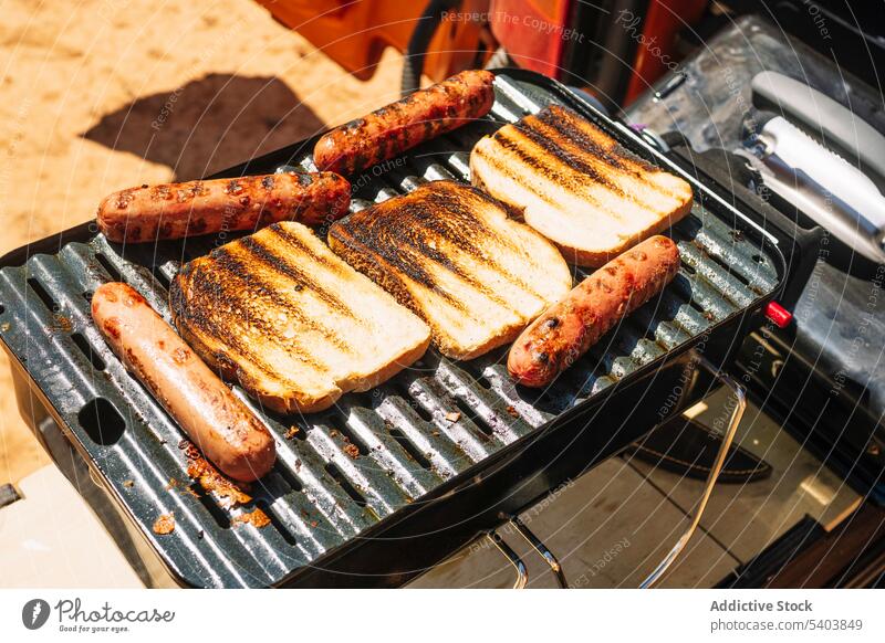 Toasts and sausages on portable grill during trip bread campsite toast travel breakfast tourism delicious morning food rojo teruel canyon spain appetizing bbq