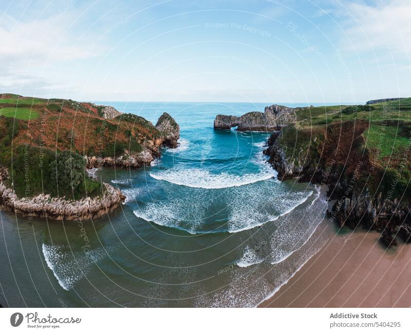 Amazing view of mountain cliff and sea under sky beach wave rocky nature cantabria shore scenic coast ocean spain water seashore weather seaside scenery