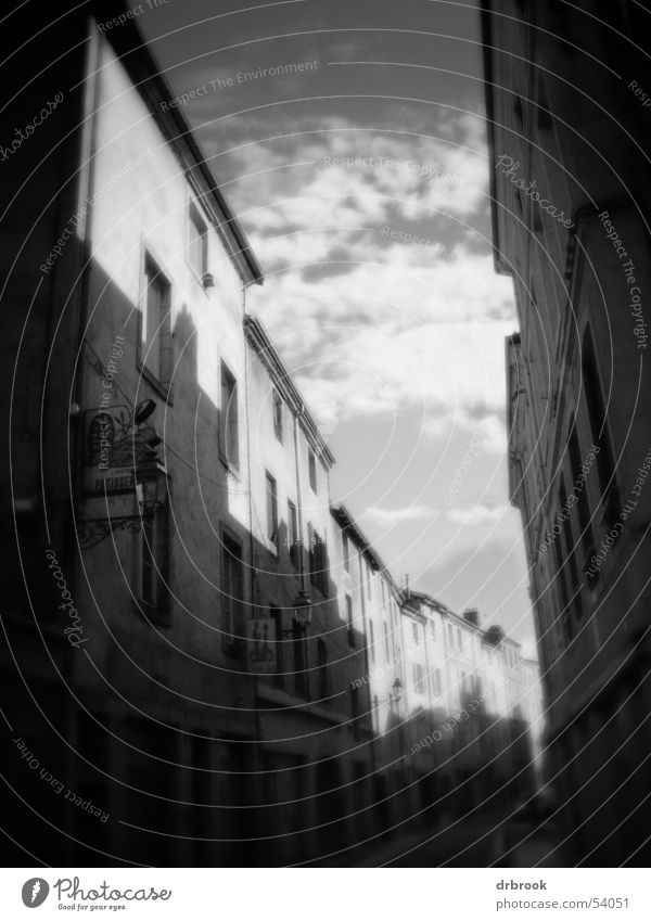 French city centre Housefront Eaves Shutter Venetian blinds Clouds House (Residential Structure) Window Roof Black Approach road Street Town Vague Unclear
