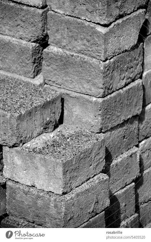 stacked paving stones Paving stone Stack pavement Heap Wall (barrier) Wall (building) Tower piled up structure Hard Cold Material Structures and shapes Firm