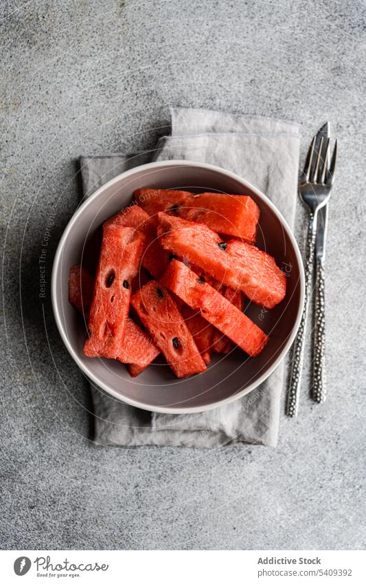 Watermelon in a bowl watermelon fresh served fruit plate dessert summer garnish tablecloth piece food diet healthy detox breakfast vegan service colorful tropic