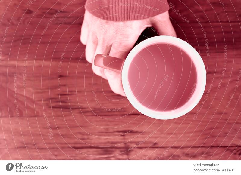 Hand with mug , magenta  monochrome magenta color still life human hand background copy space holding mug top view drink cup cafe one person bar drinking