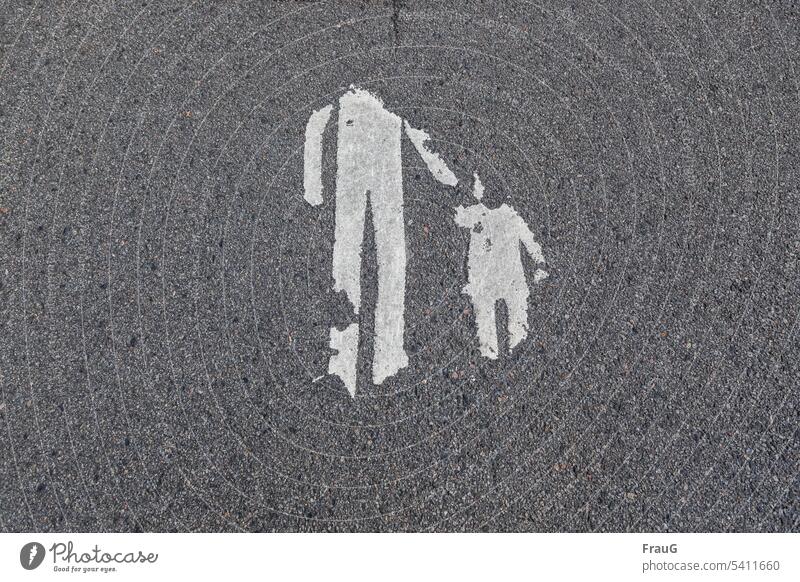 the | favorite hairstyle | is gone - and so is the head... Street Asphalt Sign Father and Child corrupted without head mark Footpath Lanes & trails Clue