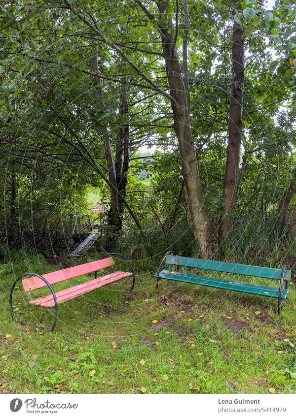 red and green park bench Park bench GDR Deserted Red Wood Calm Colour photo Nature Break Sit Loneliness Relaxation Wooden bench Bench Seating Exterior shot