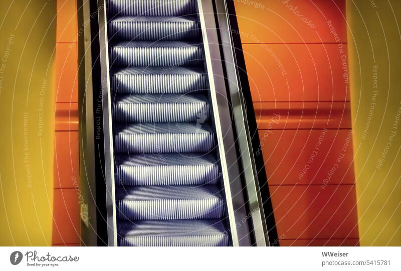 Detail of escalator in colorful geometric environment Escalator Steep Upward Driving Metal Modern Orange Yellow promote Empty Stairs Downward Shopping malls