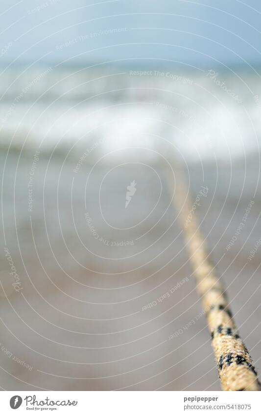 moored - boat attached to the beach with a rope bubbling water wave Waves Swell Undulation Wave action Ocean ocean Sea water Water Wave break Wavy line coast