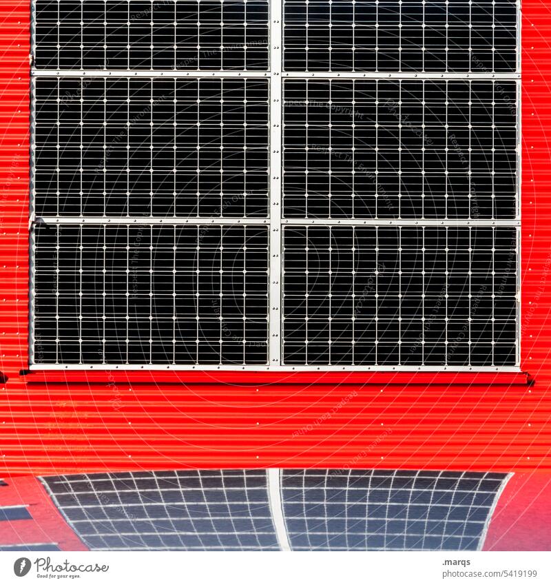 Solar cells on red wall Close-up Eco-friendly Red Solar Power Renewable energy Future Energy industry Power consumption Alternative Environmental protection