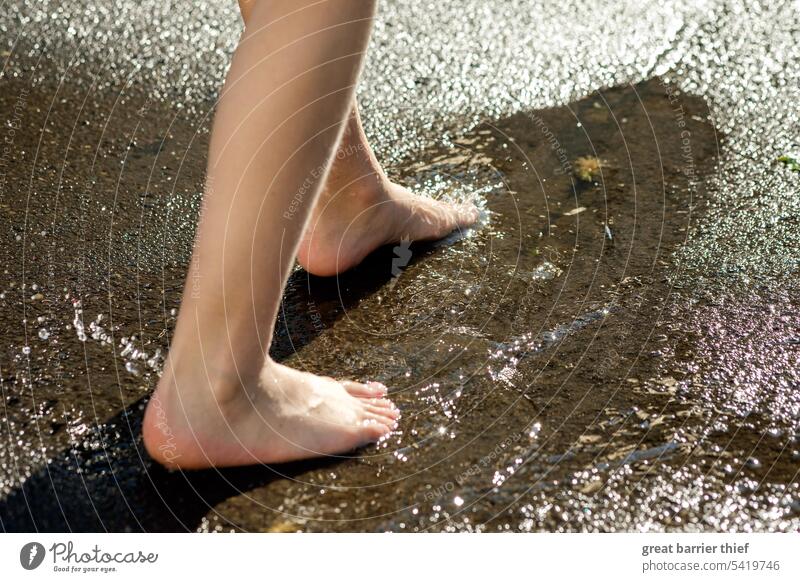 Feet on wet road feet Wet Summer Hot Exterior shot Legs Relaxation Barefoot Toes Water Girl Puddle Street Refreshment reflection Asphalt on the street