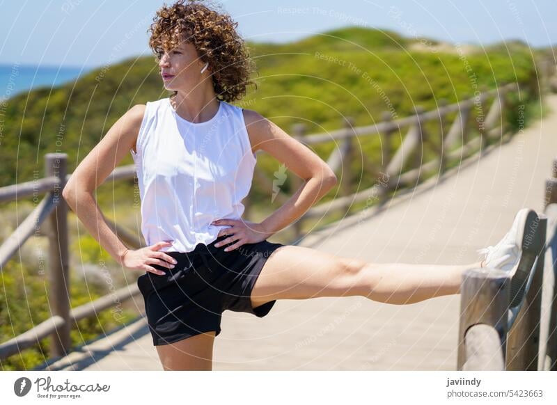 Calm woman sitting in lotus pose on pier yoga meditate asana calm nature zen wellness energy mindfulness spirit concentrate position healthy relax vitality