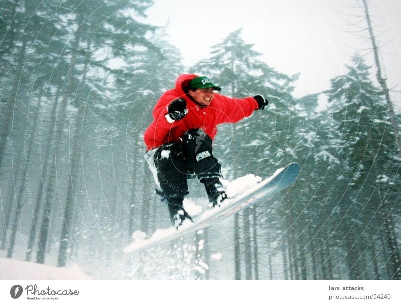 leap of luck Jump Snowboard Winter Air Red Forest Ski jump Winter sports Thrill Joy Funsport Enthusiasm Tall far Speed Bright Colours 1 Snowboarder Snowboarding