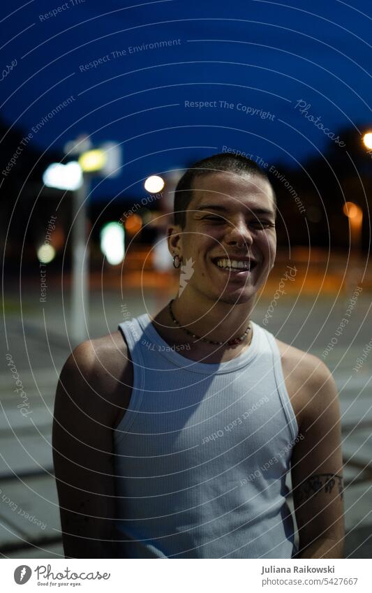 laughing young man walking in the city at night bokeh Lifestyle younger gen z Esthetic Young man Human being portrait Authentic naturally Night Ease
