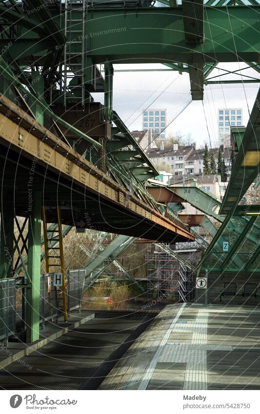 Steel girders of the track at a station of the Wuppertal suspension railroad over the river Wupper in springtime in the city center of Wuppertal in the Bergisches Land in North Rhine-Westphalia, Germany