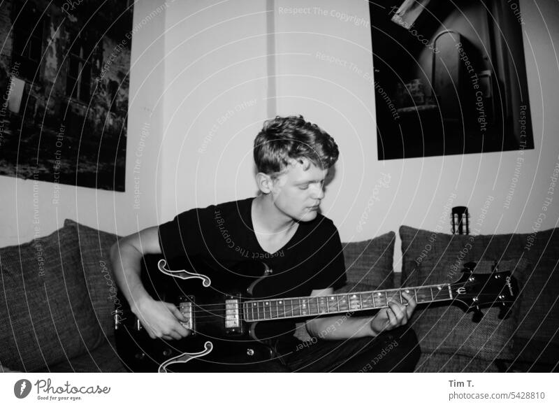 Bass guitar b/w Man Black & white photo B/W Day Interior shot Berlin Prenzlauer Berg