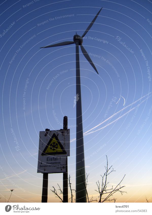 Dangerous wind power Wind energy plant Sunset Winter Warning sign Icefall Sky Blue sky Signs and labeling Threat enter at your own risk