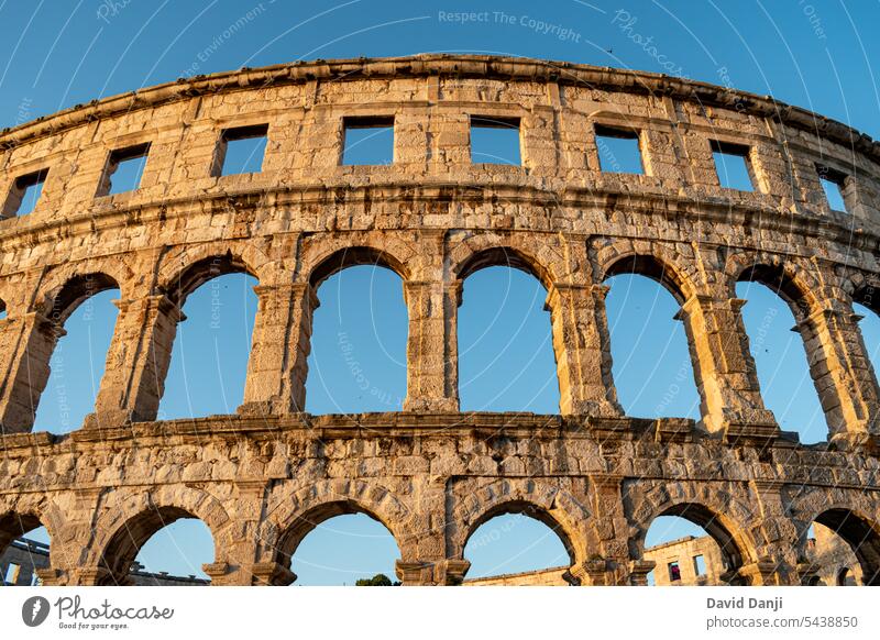 Pula Arena is a Roman amphitheatre located in Pula, Croatia. This photo is taken in July, 2023. adriatic amphitheater ancient antique arch archaeology