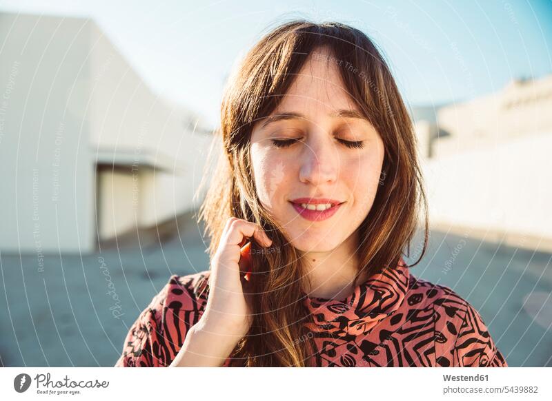 Portrait of a woman with closed eyes, daydreaming portrait portraits mid adult women mid adult woman mid-adult women mid-adult woman day dreaming Daydreams