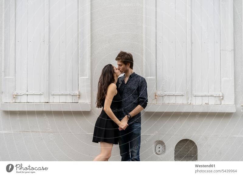 young couple standing in embrace in a rural setting Stock Photo - Alamy