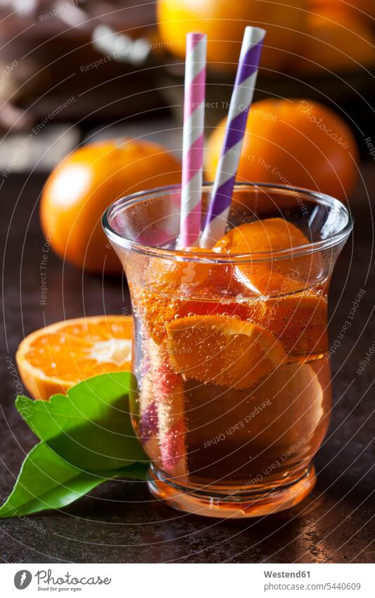 Fruit spritzer of tangerines in a glass with drinking straws nobody soft drink refreshing drink soft drinks refreshing drinks Leaf Leaves Refreshment Glass
