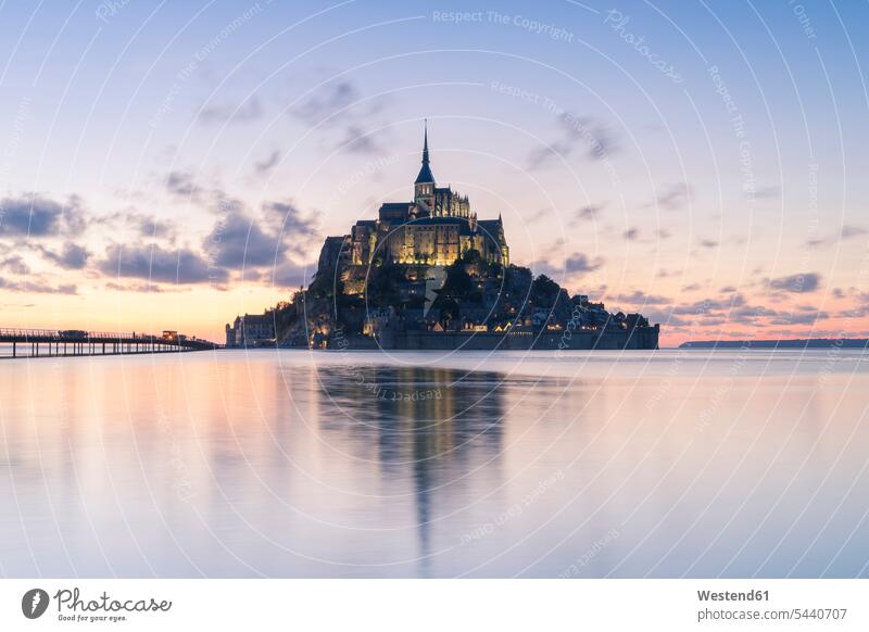 France, Normandy, view to lighted Mont Saint-Michel in the evening cultural monument water reflection water reflections Upper Normandy Haute-Normandie