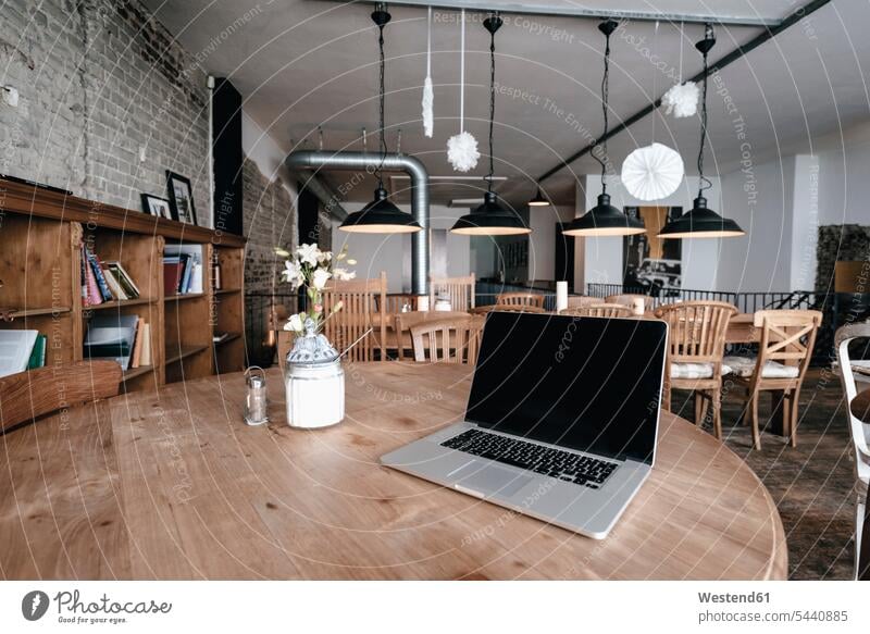 Laptop on a table in a cafe Absence Absent Connection connected Connections connectivity laptop Laptop Computers laptops notebook mobile working Internet