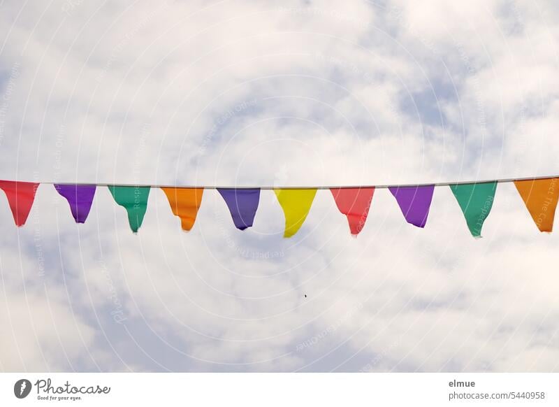 colorful pennant chain in front of slightly cloudy sky Paper chain Fabric garland variegated Colour colored celebration Adorned Firm celebrate with a party