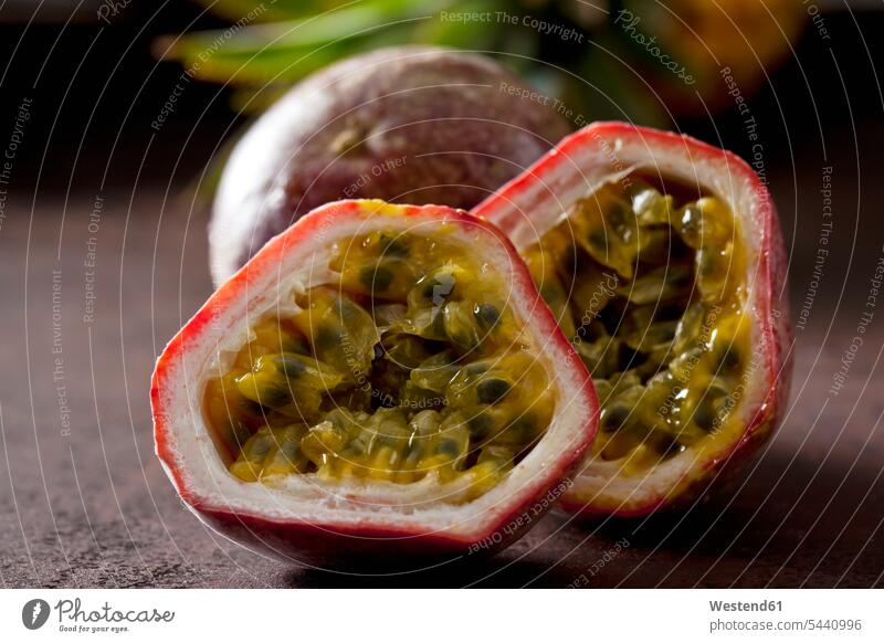 Sliced passion fruit, close-up nobody flesh pulp sliced half halves halved healthy eating nutrition Passion Fruit Maracuja Passion Fruits Tropical Fruit