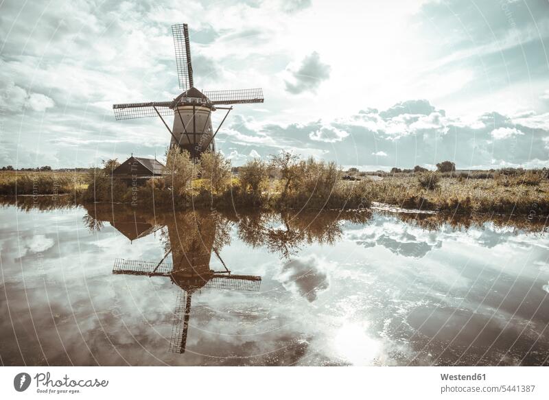 Netherlands, Kinderdijk, Kinderdijk wind mill cloud clouds water reflection water reflections nature natural world outdoors outdoor shots location shot