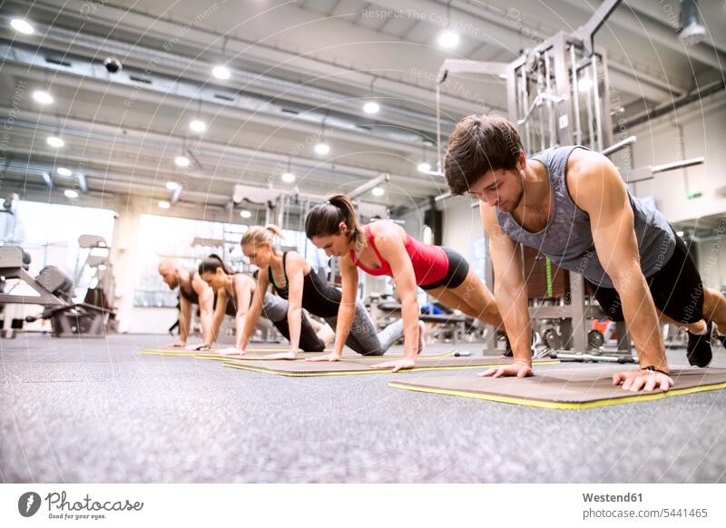 Two women working out in gym - a Royalty Free Stock Photo from Photocase