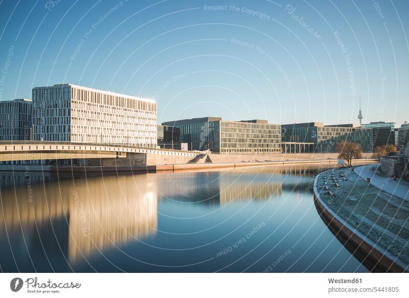 Germany, Berlin, view to Hugo Preuss Bridge with River Spree in the foreground n the morning modern contemporary water reflection water reflections building