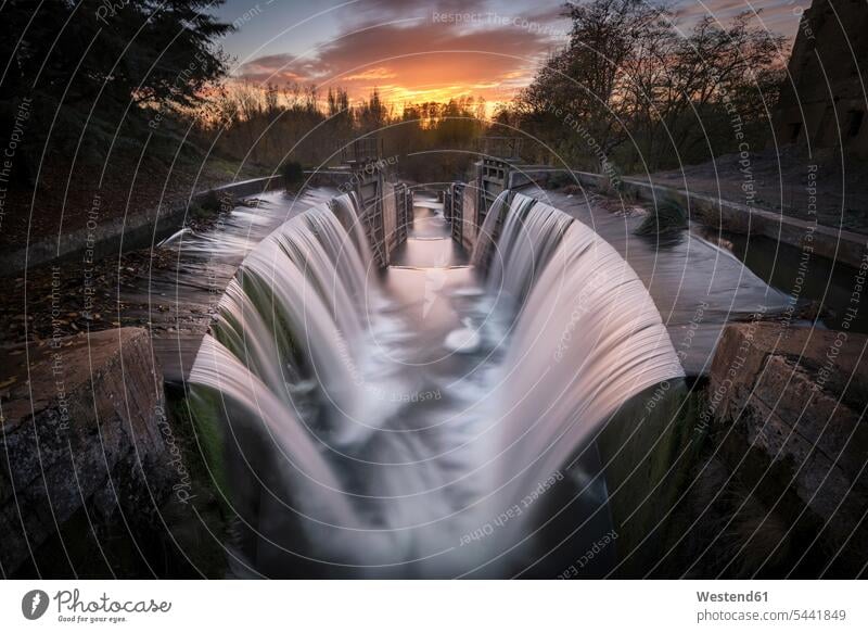Spain, Palencia, Canal de Castilla, waterfall, long exposure at sunset motion Movement moving evening light flowing nature natural world waterfalls sunsets