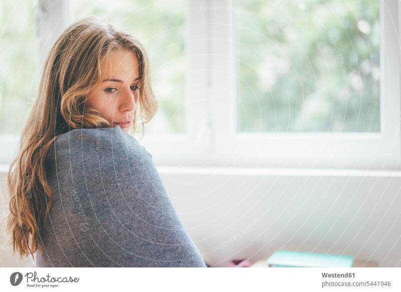 Portrait of young woman wrapped in a blanket females women Blanket Blankets portrait portraits Adults grown-ups grownups adult people persons human being humans