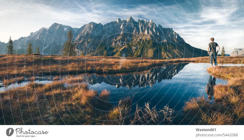 Austria, Hochkoenig, Mandlwand and man standing at moor pond caucasian caucasian ethnicity caucasian appearance european journey travelling Journeys voyage View