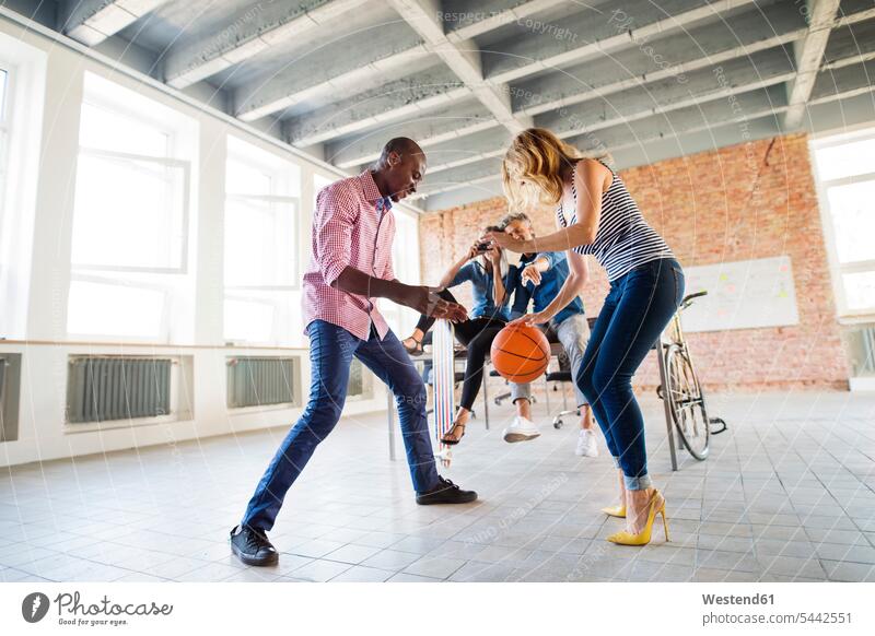 Collegues playing basketball in their new office team colleagues Office Offices dribbling dribbling ball dribble Basketball loft lofts sport sports young women