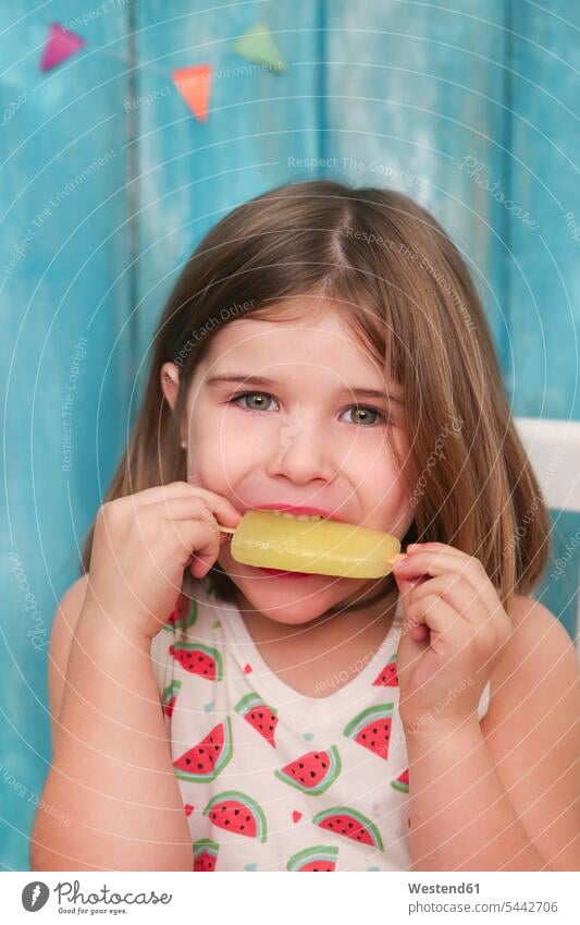 Portrait of little girl eating lemon ice lolly females girls child children kid kids people persons human being humans human beings Sweet Food sweet foods