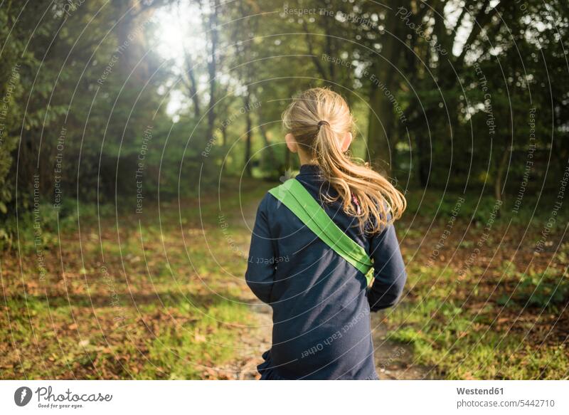 Rear view of girl in a forest females girls woods forests nature natural world child children kid kids people persons human being humans human beings