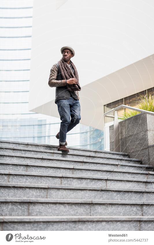 Man walking down stairs man men males stairway Adults grown-ups grownups adult people persons human being humans human beings fashionable downwards Downward