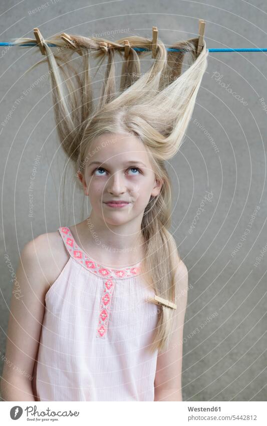 Blond girl's hair drying on clothesline females girls portrait portraits people persons human being humans human beings child children kid kids Clothesline