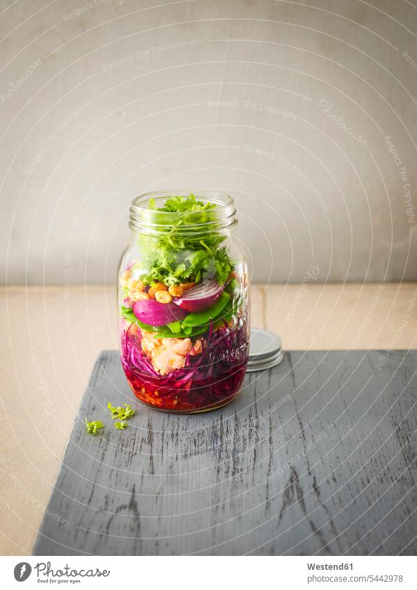 Preserving jar of raw food with fried salmon, chili sauce and peanuts Vignette Salad Salads wooden Fork Forks Vegetable Vegetables Leaf Leaves Leaf Salad